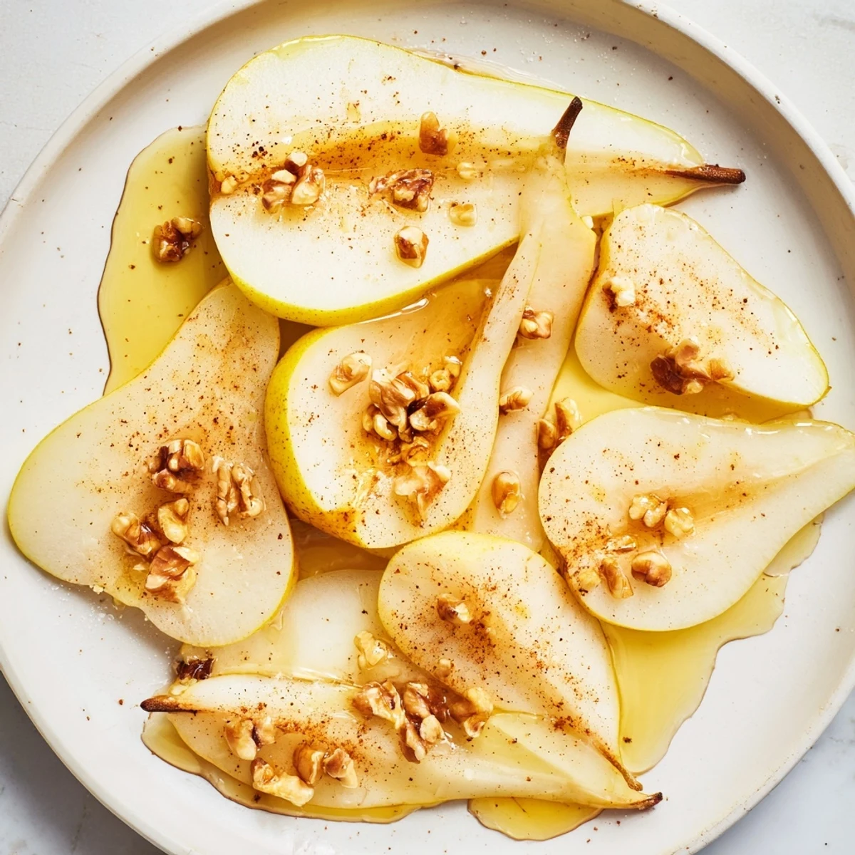 Crisp pear slices with honey drizzle, a light dessert perfect for a quick snack.