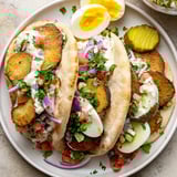 This photo features a colorful Israeli Sabich, a filling meal with tahini and eggs.