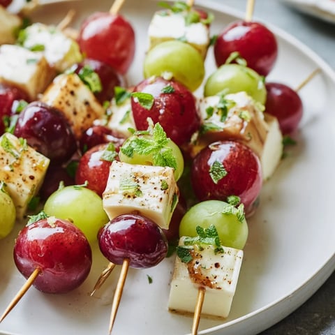 Sparkling Grape and Cheese Skewers arranged on a platter ready to be served, a simple yet elegant appetizer.