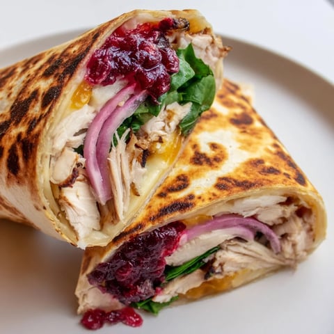 Chicken and Brie Holiday Wrap, melty brie oozing from a toasted wrap, a perfect holiday lunch.