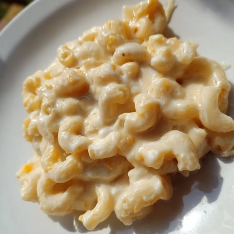 A steaming bowl of creamy mac and cheese, perfectly golden and bubbly, ready to serve.