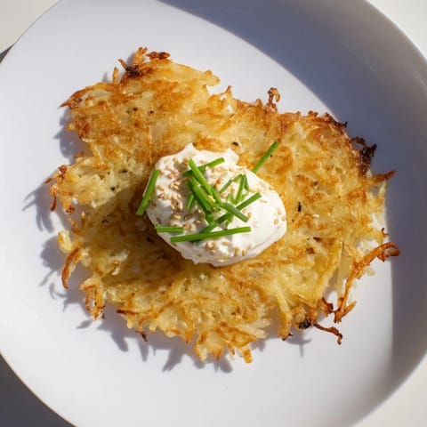 Imagine the savory Kartoffelpuffer: perfectly fried, served with a creamy spicy kimchi dip.