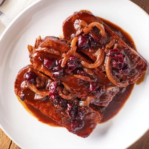 Hearty Vegan Sauerbraten with a rich, dark gravy, perfect for a special meal.
