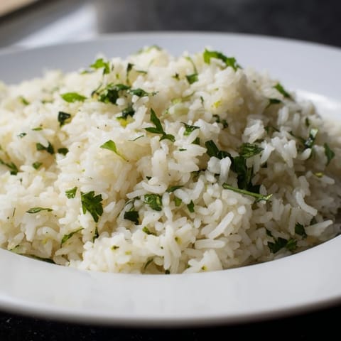 Fresh cilantro lime rice, ready to serve, a flavorful accompaniment to tacos or grilled chicken.