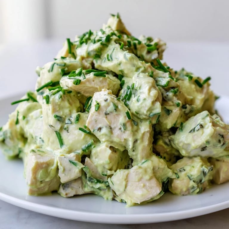 Savory Avocado Ranch Chicken Salad served on mixed greens with diced cucumber, cherry tomatoes and celery.